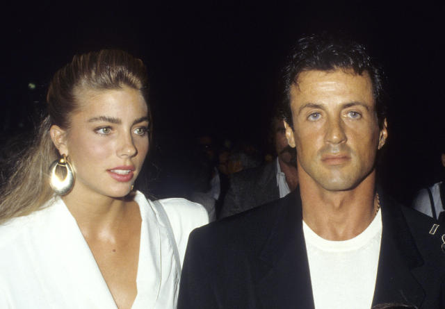 Actor Sylvester Stallone and date Jennifer Flavin standing together in the late 80s