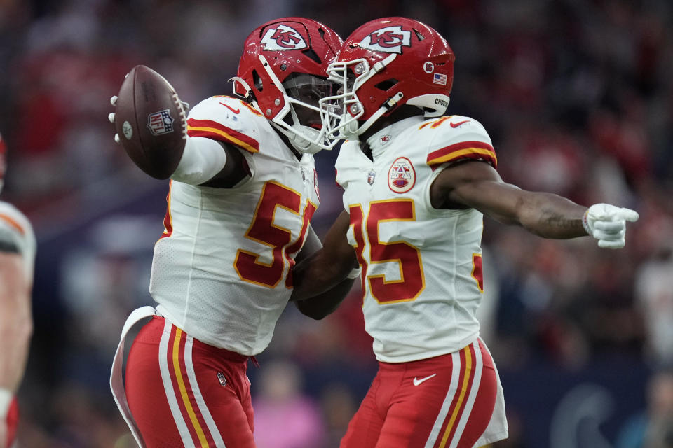Kansas City Chiefs linebacker Willie Gay (50) celebrates with teammate cornerback Jaylen Watson (35) after he recovered a fumble against the Houston Texans during overtime in an NFL football game Sunday, Dec. 18, 2022, in Houston. (AP Photo/Eric Christian Smith)