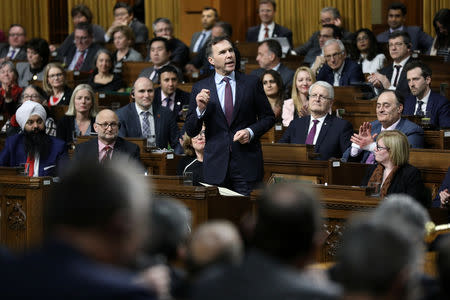 Canada's Finance Minister Bill Morneau speaks during Question Period in the interim House of Commons in the West Block on Parliament Hill in Ottawa, Ontario, Canada, February 20, 2019. REUTERS/Chris Wattie