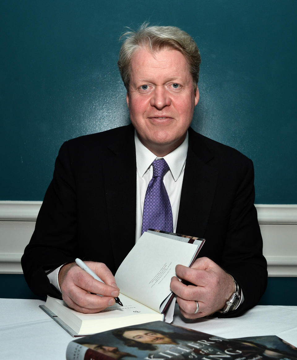 Earl Charles Spencer signs his new book on the day of Archie's christening