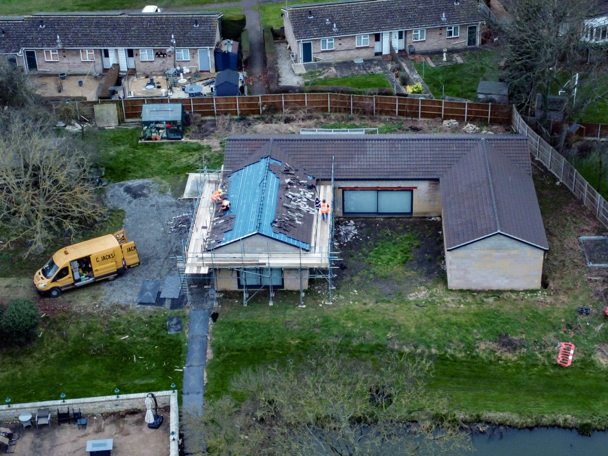 Tiles can be seen being removed from the spa building belonging to Hannah Ingram-Moore. (SWNS)