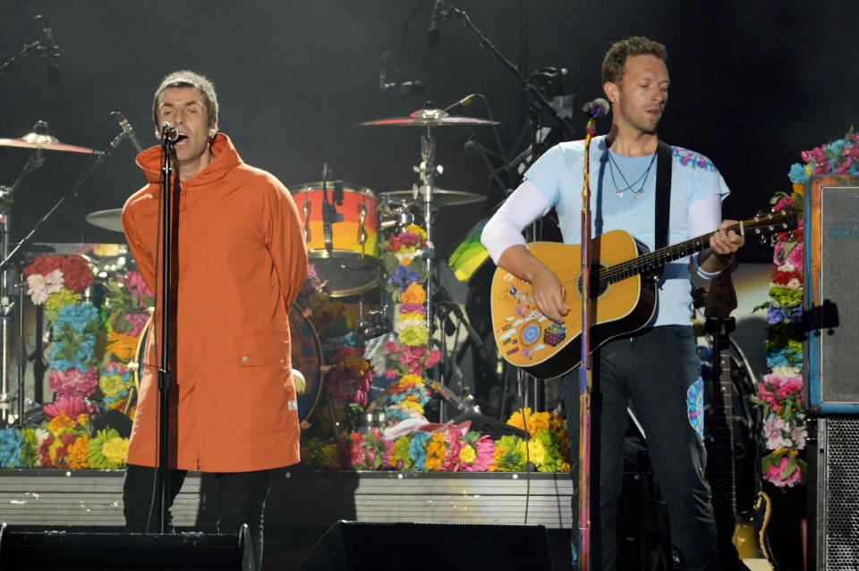 In this handout provided by 'One Love Manchester' benefit concert (L) Liam Gallagher and Chris Martin perform on stage on June 4, 2017 in Manchester, England.