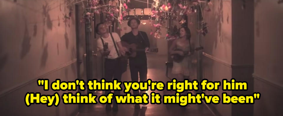 Still from the music video with the lyric: "I don't think you're right for him, (Hey) think of what it might've been"