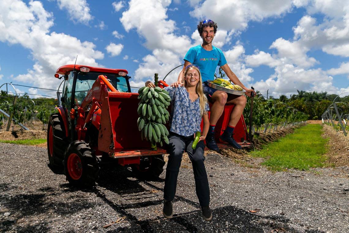 Rane Roatta, 29, and Edelle Schlegel, 25, the founders of Miami Fruit, hold some of the tropical fruits they sell online from their farm in Homestead, Fla. Miami Fruit, an online company that sends boxes of fruits to customers around the United States and the world, uses social media to promote their products to their followers.