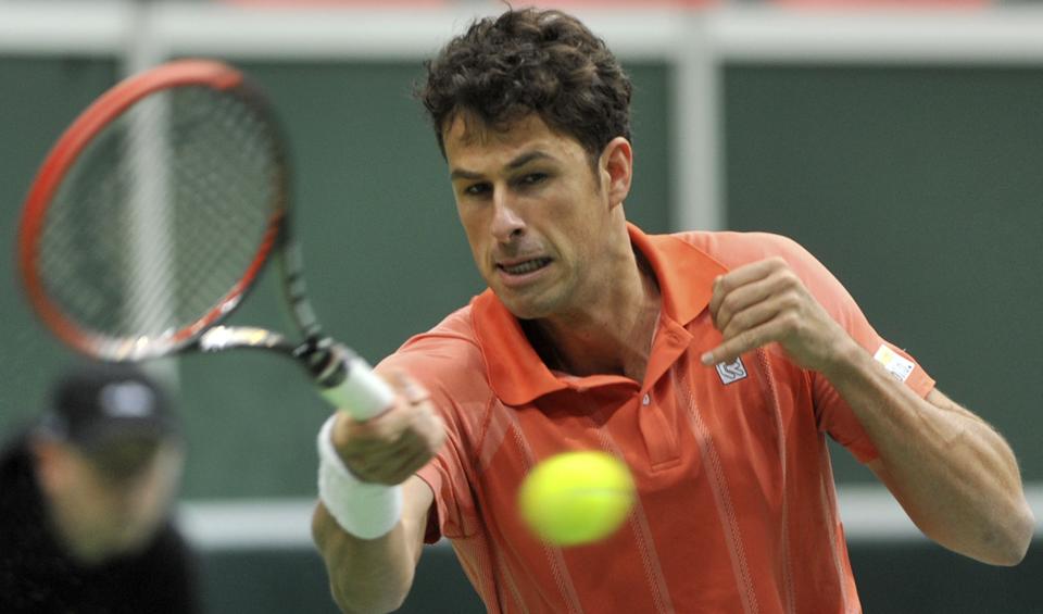Robin Haase from the Netherlands returns the ball to Radek Stepanek from Czech Republic during their opening single of the tennis Davis Cup first round match in Ostrava, Czech Republic, Friday, Jan. 31, 2014. (AP Photo,CTK/Jaroslav Ozana) SLOVAKIA OUT