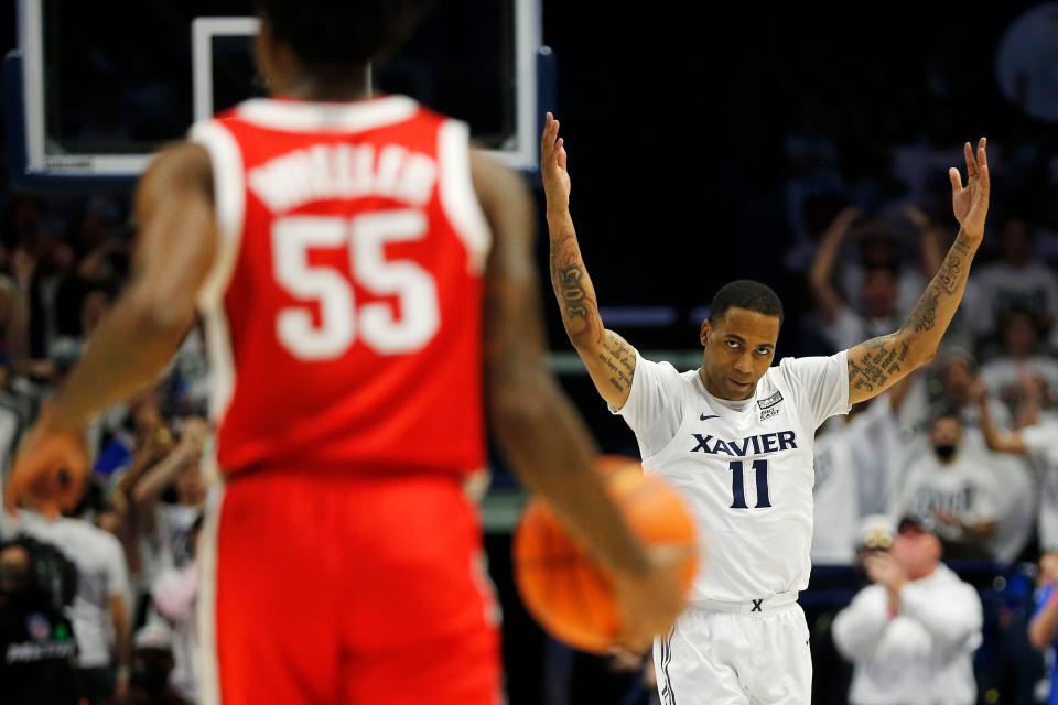 Xavier Musketeers guard Dwon Odom (11) pumps up the crowd in the second half of the NCAA basketball game between the Xavier Musketeers and the Ohio State Buckeyes at the Cintas Center in Cincinnati on Thursday, Nov. 18, 2021. Xavier defeated the 19-ranked Buckeyes, 71-65.