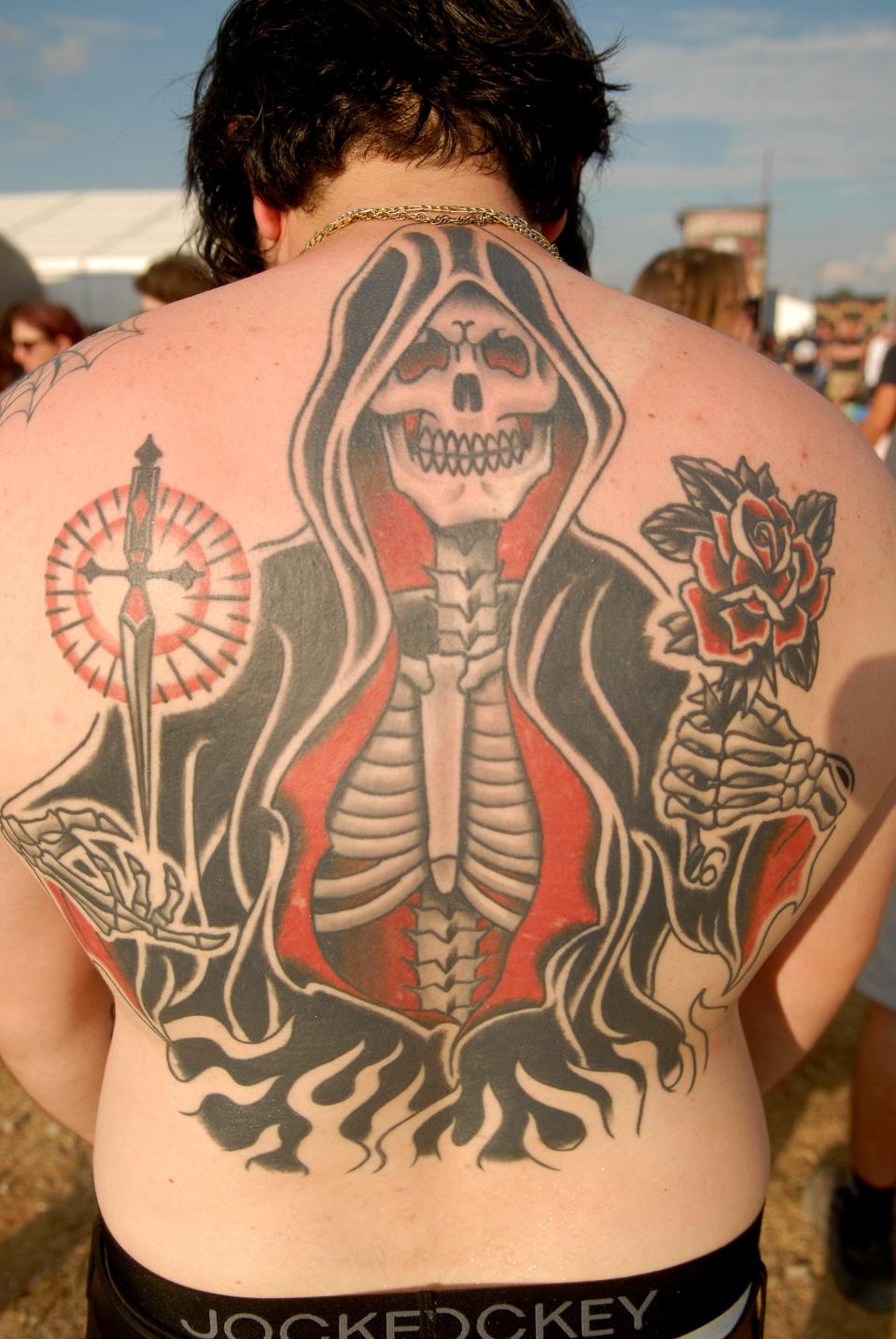 Nick Owen poses with his tattoo at Louder Than Life on Friday. Sept. 22, 2023