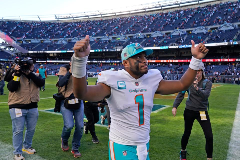 Miami Dolphins quarterback Tua Tagovailoa gives two thumbs up as he walks off the field after the Dolphins beat the Bears 35-32 in an NFL football game, Sunday, Nov. 6, 2022 in Chicago. (AP Photo/Charles Rex Arbogast)