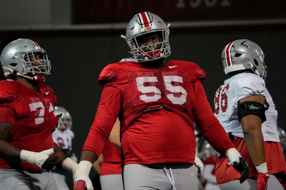 Ohio State Buckeyes offensive lineman Matthew Jones (55) warms up during a spring football practice at the Woody Hayes Athletics Center in Columbus on March 22, 2022.