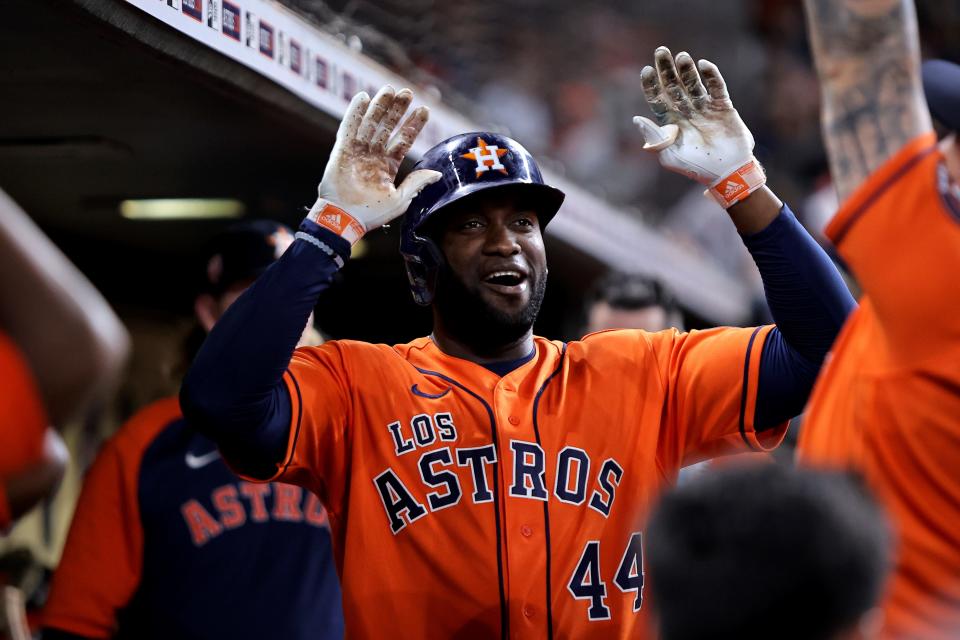 Houston Astros left fielder Yordan Alvarez (44) is greeted after hitting a home run against the Oakland Athletics at Minute Maid Park.