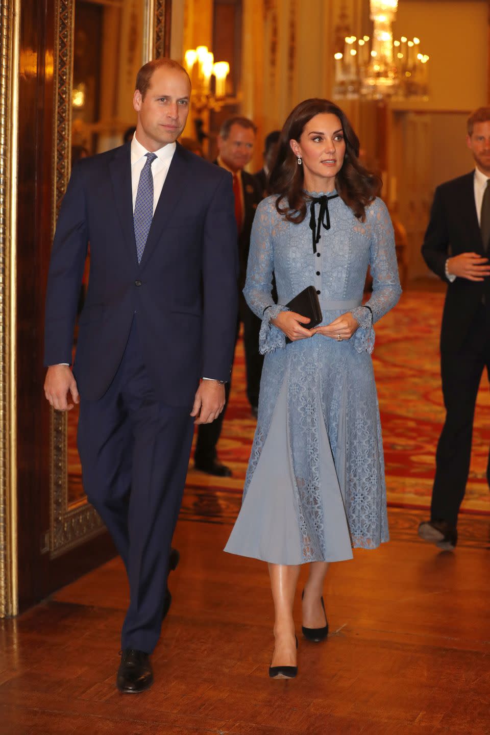 <p>The Duchess wears a blue lace Temperley London Dress, black pumps, and a clutch at Buckingham Palace for a World Mental Health Day celebration. This marked her <a href="https://www.harpersbazaar.com/celebrity/latest/a12816892/kate-middleton-first-appearance-third-pregnancy/" rel="nofollow noopener" target="_blank" data-ylk="slk:first public appearance;elm:context_link;itc:0;sec:content-canvas" class="link ">first public appearance</a> since announcing her third pregnancy.</p>