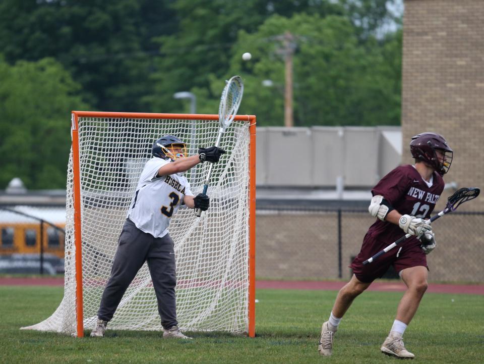 Highland's Landon Zehr clears the ball after saving a shot form New Paltz's Jack Hyland during Tuesday's Section 9 Class C semifinal in Highland on June 8, 2021. 