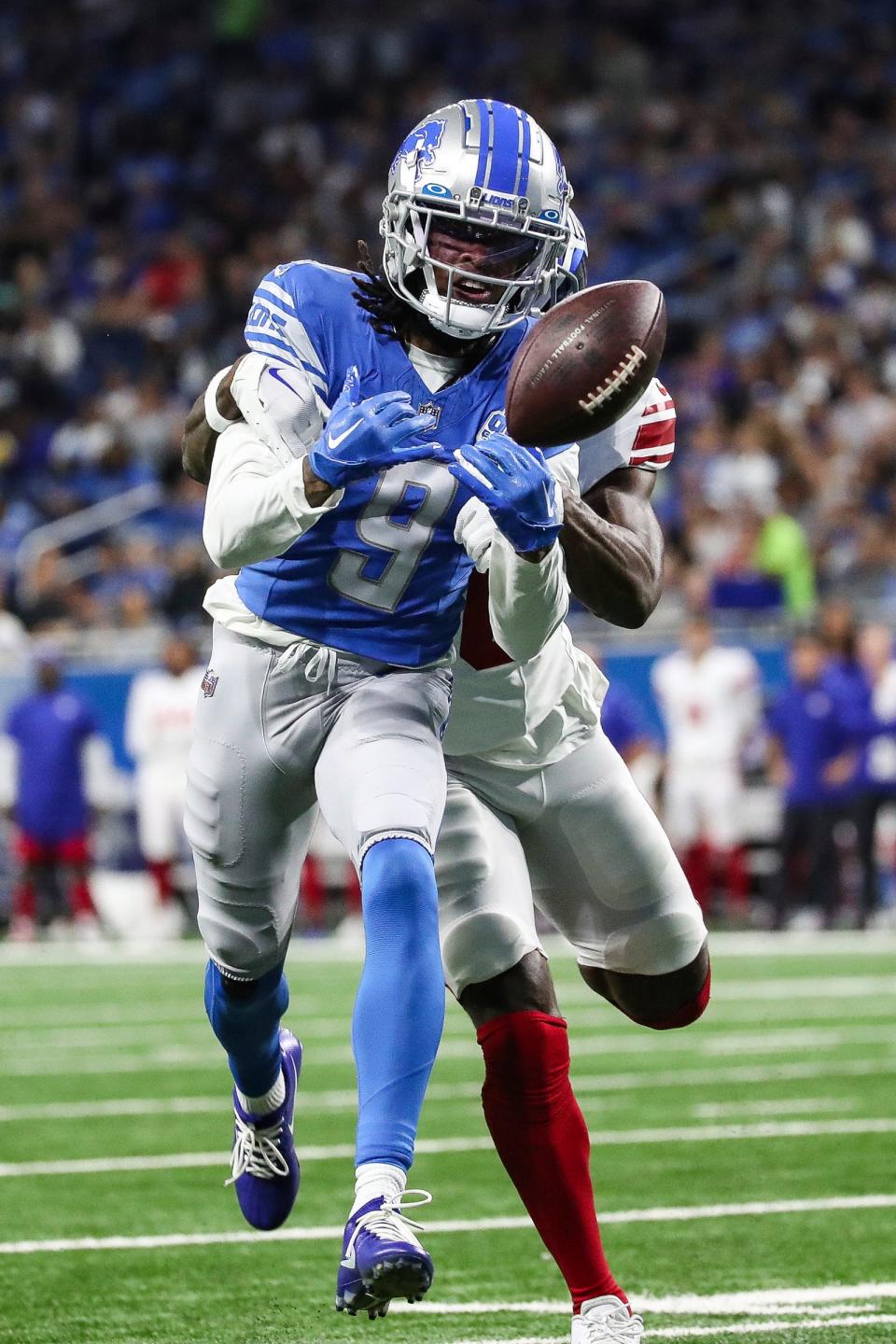 Detroit Lions wide receiver Jameson Williams (9) misses a catch against New York Giants cornerback Deonte Banks (36) during the first half of a preseason game at Ford Field in Detroit on Friday, Aug. 11, 2023.