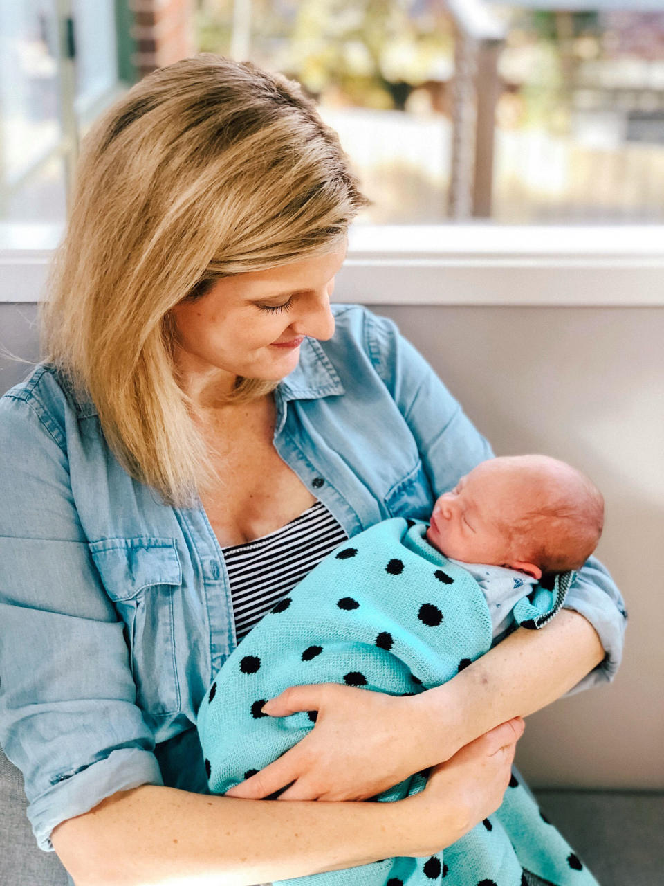 Sarah Mill pictured with baby son Oliver. [Photo: Caters]