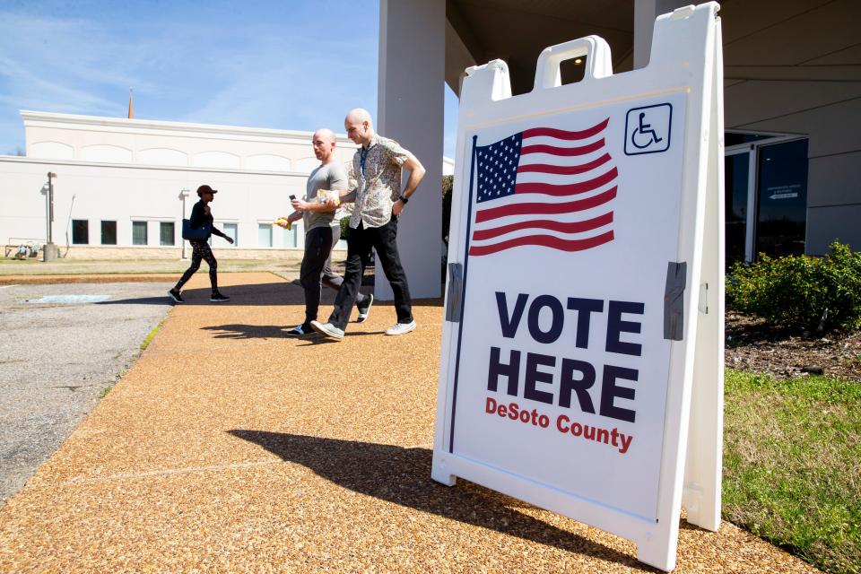 Voters walk in and out of the polling location at Cornerstone Church in Southaven, Miss., on Tuesday, March 12, 2024.