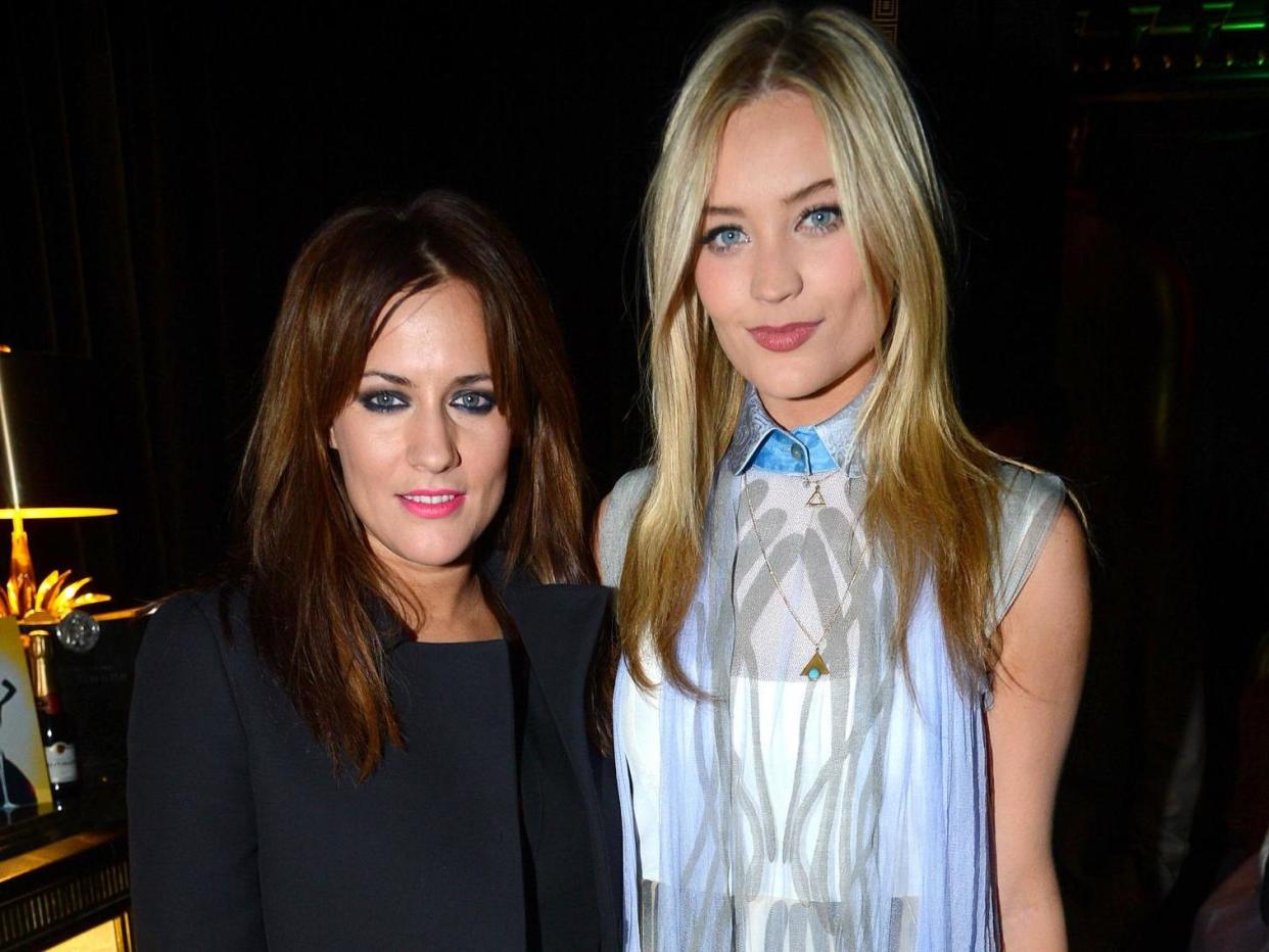 Laura Whitmore (right) with Caroline Flack in 2013: Rex