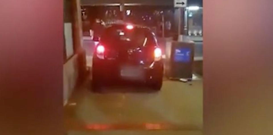 The Uber driver filmed driving on the footpath has claimed taxi drivers deliberately parked him in. Photo: Supplied