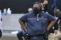 FILE - In this Nov. 8, 2020, file photo, Houston Texans head coach Romeo Crennel looks on during the first half of an NFL football game against the Jacksonville Jaguars in Jacksonville, Fla. There are only two general managers of color in the NFL. Of the 30 full-time coaches today, only four are minorities; both the interim coaches in Houston (Crennel) and Atlanta (Raheem Morris) are Black.(AP Photo/Gary McCullough, File)