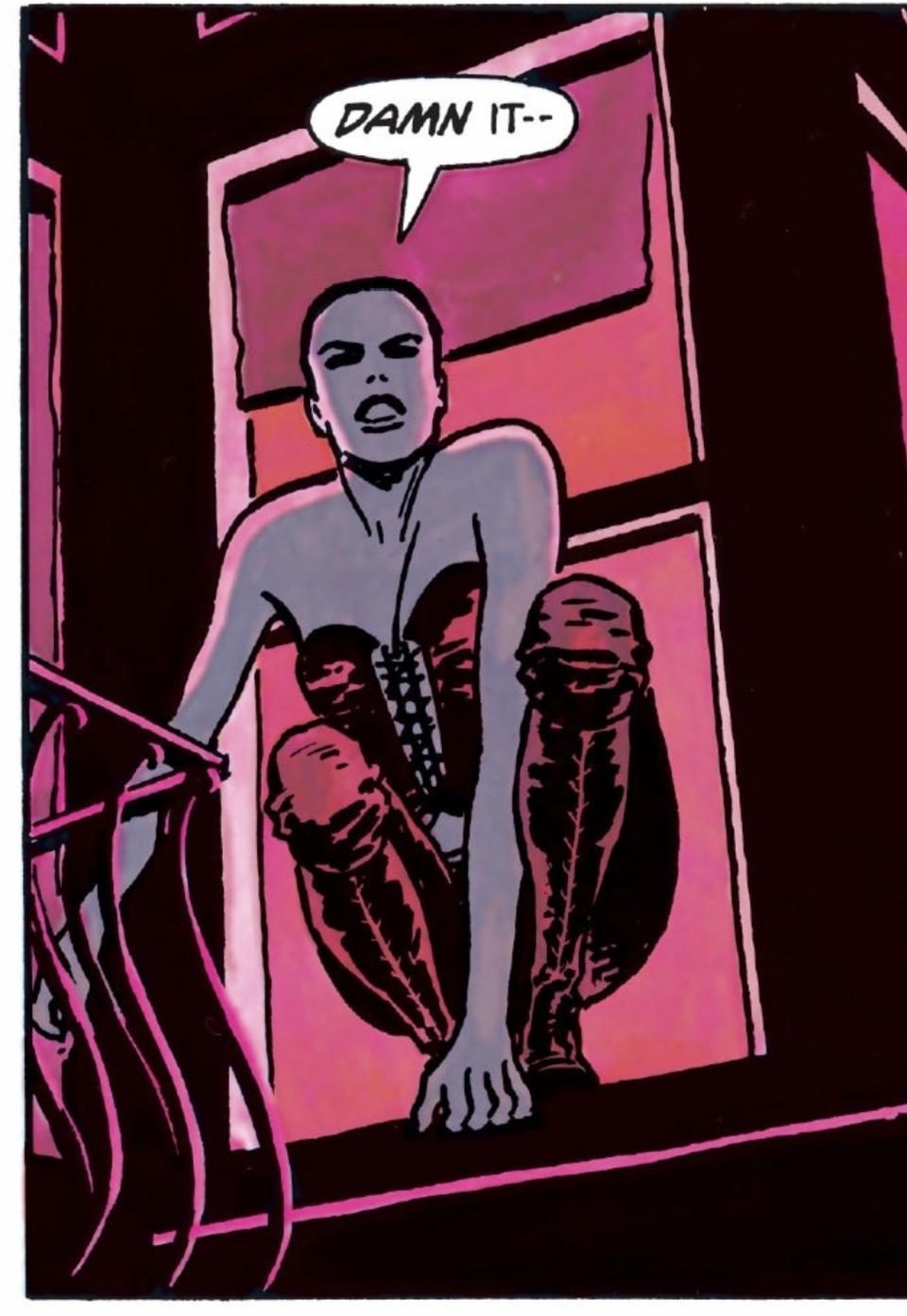 A panel from Batman: Year One by David Mazzuchelli shows Selina Kyle in leather corset and pants looking out of a window the light shining pink out of her apartment
