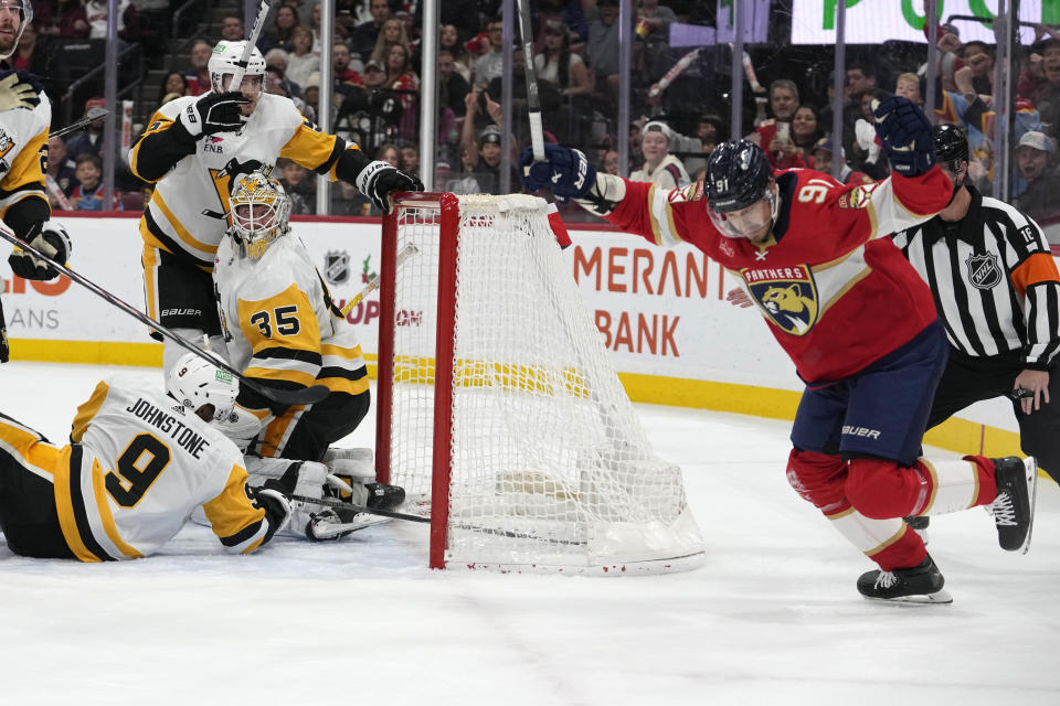 Florida Panthers defenseman Oliver Ekman-Larsson (91) reacts after scoring a goal against Pittsburgh Penguins goaltender Tristan Jarry (35) during the second period of an NHL hockey game, Friday, Dec. 8, 2023, in Sunrise, Fla. (AP Photo/Lynne Sladky)