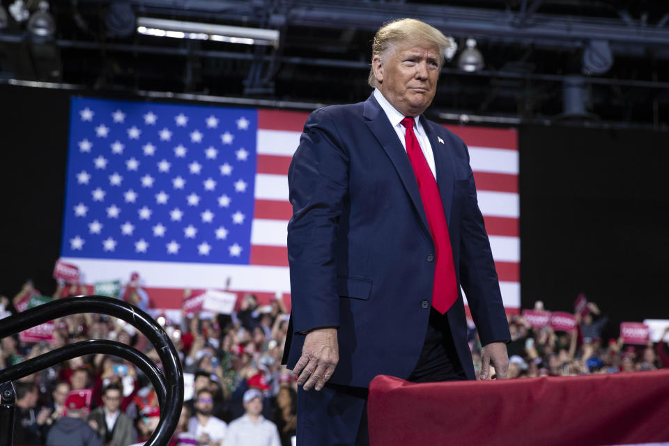 President Donald Trump arrives at Kellogg Arena to speak at a campaign rally, Wednesday, Dec. 18, 2019, in Battle Creek, Mich. (AP Photo/ Evan Vucci)