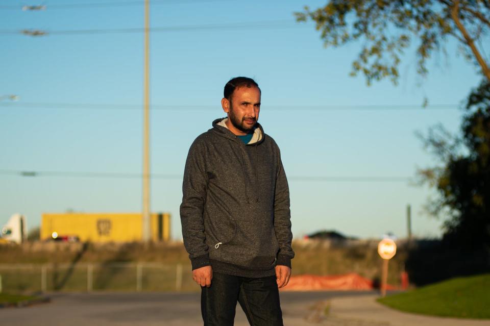 <span class="caption">An Afghan refugee stands outside the Mississauga, Ont., hotel where he and his family stayed when arriving from Afghanistan in October 2021.</span> <span class="attribution"><span class="source">THE CANADIAN PRESS/Eduardo Lima</span></span>