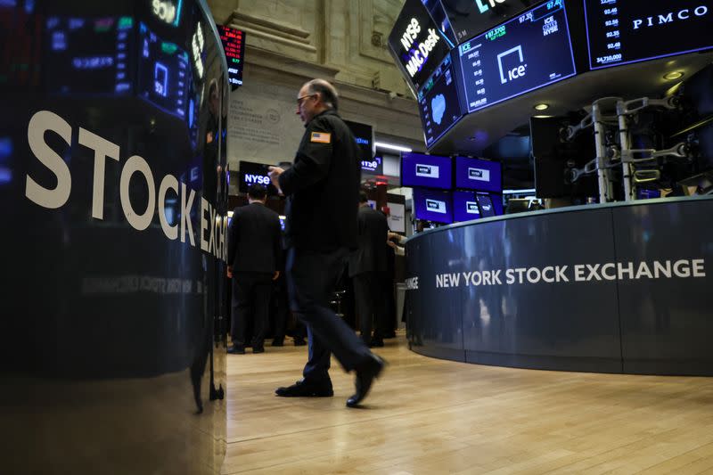 Traders work on the floor of the NYSE in New York