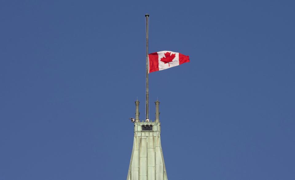<p> The flag flies at half-mast on the Peace tower Monday Jan. 30, 2017 in Ottawa. It was announced Monday that the flag would fly at half-mast in memory of the victims of the Quebec City shooting.(Adrian Wyld/The Canadian Press via AP) </p>