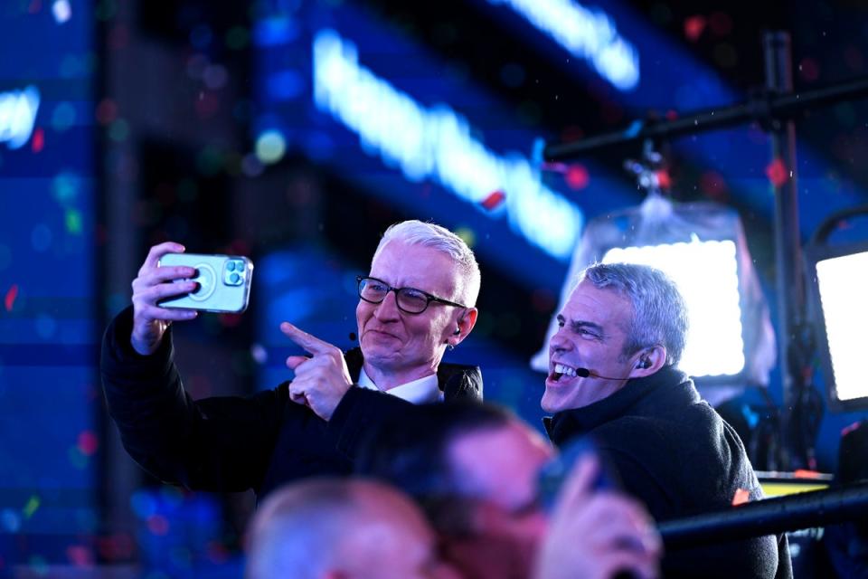 Anderson Cooper and Andy Cohen pose for a selfie during the Times Square New Year's Eve 2023 Celebration on December 31, 2022 in New York City. (Getty Images)