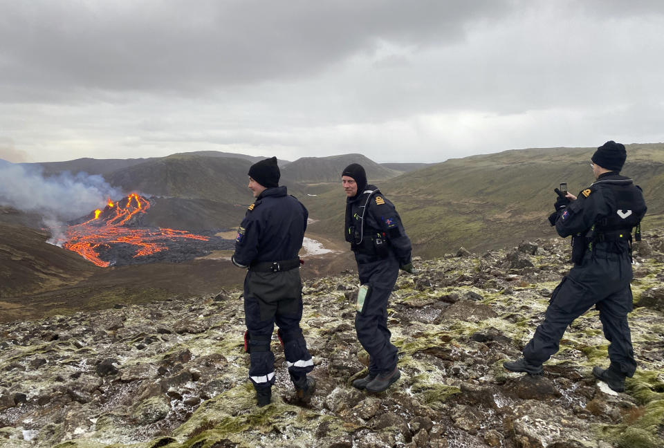 This image provided by the Icelandic Coast Guard shows a volcano on the Reykjanes Peninsula in southwestern Iceland on Saturday March 20, 2021. A long dormant volcano on the Reykjanes Peninsula flared to life Friday night, spilling lava down two sides in that area's first volcanic eruption in nearly 800 years. Initial aerial footage, posted on the Facebook page of the Icelandic Meteorological Office, showed a relatively small eruption so far, with two streams of lava running in opposite directions. (Icelandic Coast Guard via AP)