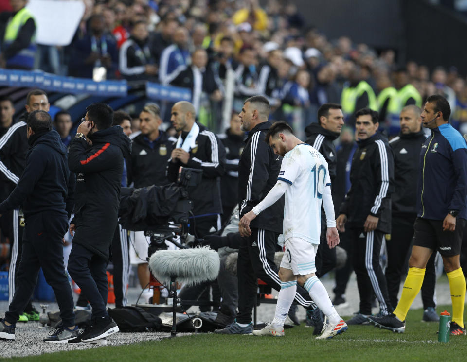 Argentina's Lionel Messi leaves the field after receiving from referee Mario Diaz, from Paraguay, a red card during Copa America third-place soccer match against Chile at the Arena Corinthians in Sao Paulo, Brazil, Saturday, July 6, 2019. (AP Photo/Victor R. Caivano)