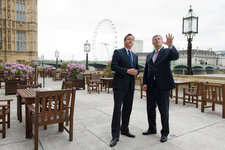 Prime Minister David Cameron talks with his Canadian counterpart Stephen Harper ahead of Mr Harper's address to the House of Commons in central London.