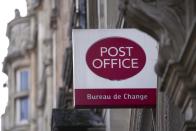 FILE - A logo of post office is displayed in London, Wednesday, Jan. 10, 2024. Lawmakers trying to get to the bottom of one of Britain’s gravest injustices are questioning bosses of the Post Office and Fujitsu on Tuesday as momentum grew to compensate and clear the names of more than 900 Post Office branch managers wrongly convicted of theft or fraud because of the Japanese company’s faulty computer system. (AP Photo/Kin Cheung, File)