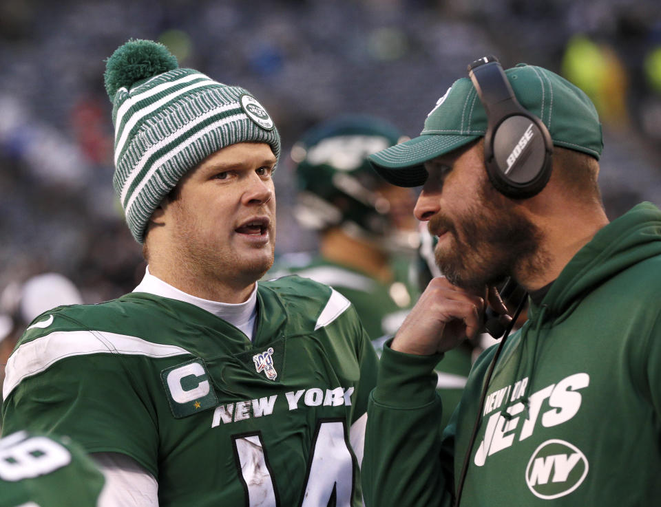 EAST RUTHERFORD, NJ - NOVEMBER 24:  Quarterback Sam Darnold #14 of the New York Jets talks with head coach Adam Gase of the New York Jets on the sideline in an NFL football game against the Oakland Raiders on November 24, 2019 at MetLife Stadium in East Rutherford, New Jersey. Jets won 34-3. (Photo by Paul Bereswill/Getty Images)