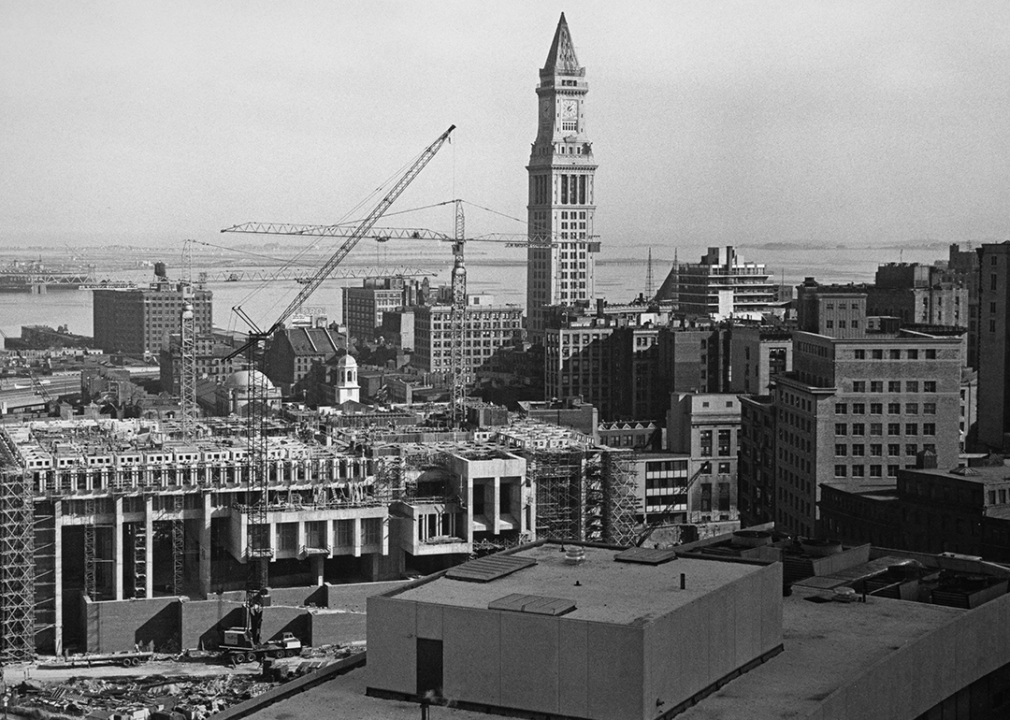 The Custom House Tower rises above cranes and construction work in Boston.