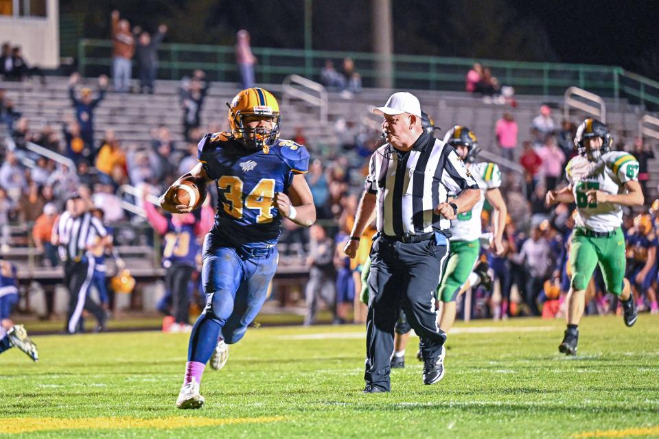 Riley’s Quatez Foster (34) scores after an interception in the second quarter against Northridge Friday, Oct. 21, 2022, at Jackson Field in South Bend.