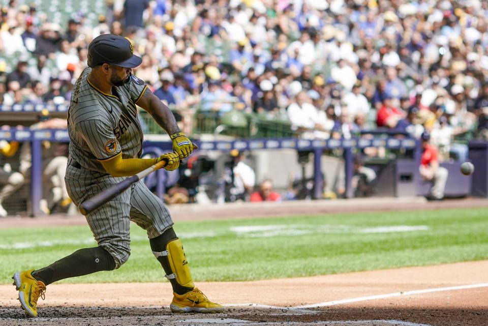 San Diego Padres' Gary Sanchez hits a two-run home run during the second inning of a baseball game against the Milwaukee Brewers Sunday, Aug. 27, 2023, in Milwaukee. (AP Photo/Morry Gash)