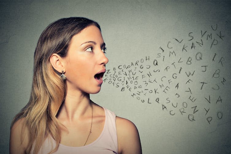 Photo of a young woman against a grey background with an illustration of a stream of alphabet letters coming out of her mouth