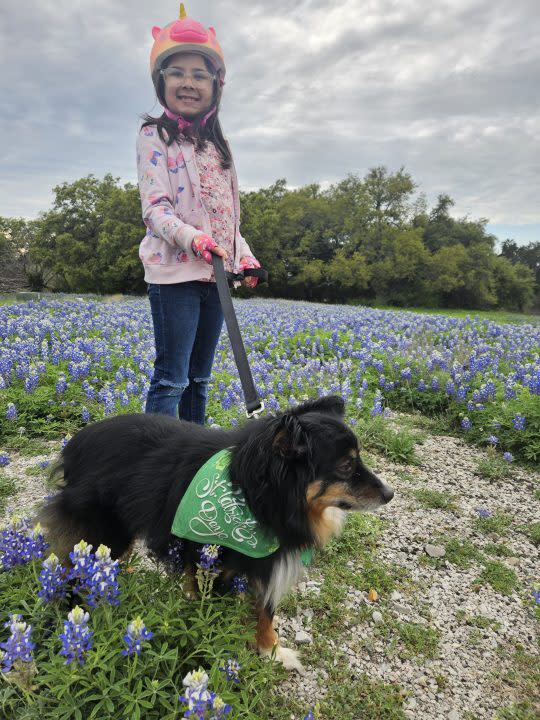 Treble the dog and Dalynn enjoy the bluebonnets (KXAN Viewer Photo)