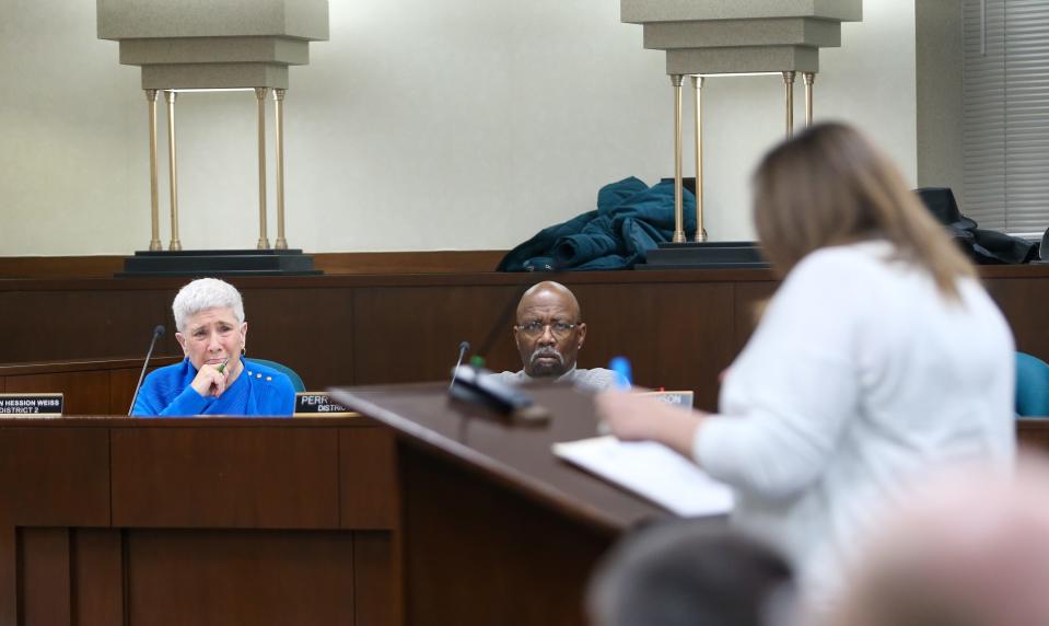 Eileen Hession Weiss, Lafayette City Councilwoman, and Perry E. Brown, Lafayette City Councilman, listen to Jen Manago the Dayton council president, explain why the board should vote no on the voluntary annexation of the Carr family property into the City of Lafayette, at May's Lafayette City Council meeting, on Monday, May 1, 2023, in Lafayette, Ind.