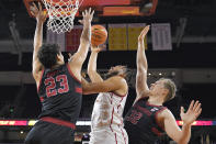 Southern California forward Isaiah Mobley, center, shoots as Stanford forward Lukas Kisunas, right, and forward Brandon Angel defend during the first half of an NCAA college basketball game Thursday, Jan. 27, 2022, in Los Angeles. (AP Photo/Mark J. Terrill)