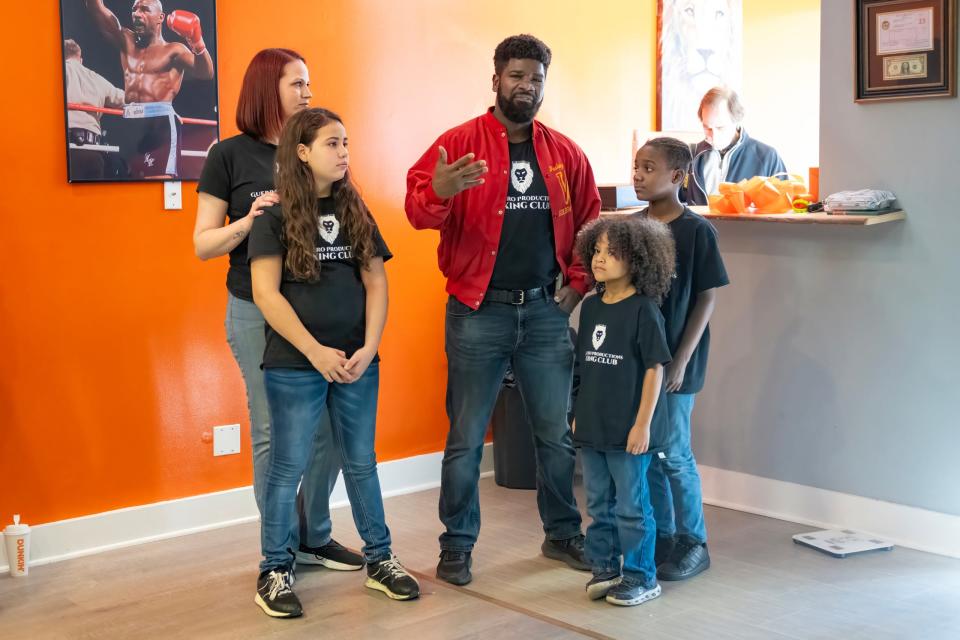 Carmelo Guerrero talks to attendees of the ribbon-cutting ceremony held Saturday, Feb. 3, 2024, at the new home of the Guerrero Productions Boxing Club on Somerset Avenue in Princess Anne