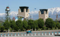 A truck rides in front of main towers at he China-Kazakhstan Horgos International Border Cooperation Center (ICBC), in Horgos, China May 12, 2017. Picture taken May 12, 2017. REUTERS/Shamil Zhumatov