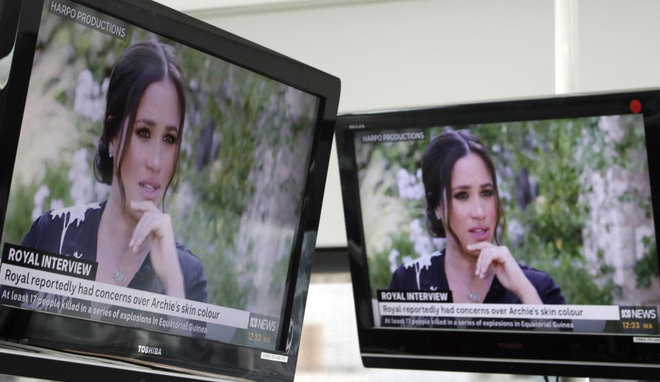 Australian television news in Sydney, Monday, March 8, 2021, reports on an interview of The Duke and Duchess of Sussex by Oprah Winfrey. The interview airs in Australia Monday evening. (AP Photo/Rick Rycroft)