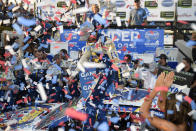 Chase Elliott, center, celebrates in Victory Lane amongst confetti after winning a NASCAR Cup Series auto race, Sunday, Oct. 7, 2018, at Dover International Speedway in Dover, Del. (AP Photo/Nick Wass)