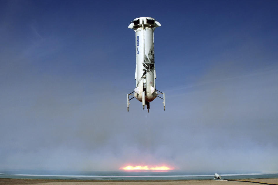 In this image provided by Blue Origin, the New Shepard rocket booster lands near Van Horn, Texas. Blue Origin, Jeff Bezos' space company, has scored another successful spaceflight, when it launched and landed the same rocket for the sixth time Wednesday. (Blue Origin via AP)