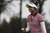 Patty Tavatanakit, of Thailand, reacts after sinking her putt on the 10th green in the second round of the Cognizant Founders Cup LPGA golf tournament, Friday, Oct. 8, 2021, in West Caldwell, N.J. (AP Photo/John Minchillo)