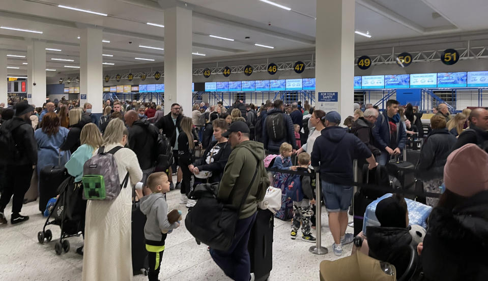 flight delays Travellers  Passengers queue inside the departures area of Terminal 1 at Manchester Airport, as the getaway starts in earnest as schools close for Easter. Picture date: Saturday April 9, 2022.