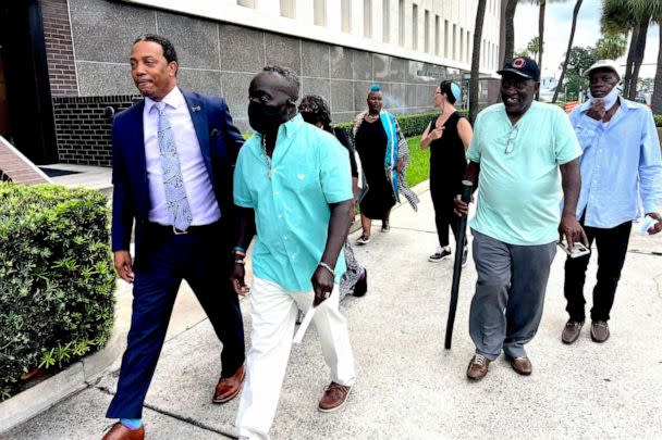 PHOTO: Marcus Arbery, second from left, father of Ahmaud Arbery, arrives at the federal courthouse, Aug. 8, 2022, in Brunswick, Ga., for the sentencing hearings of the 3 white men convicted of federal hate crimes in the killing of Arbery. (Lewis M. Levine/AP)