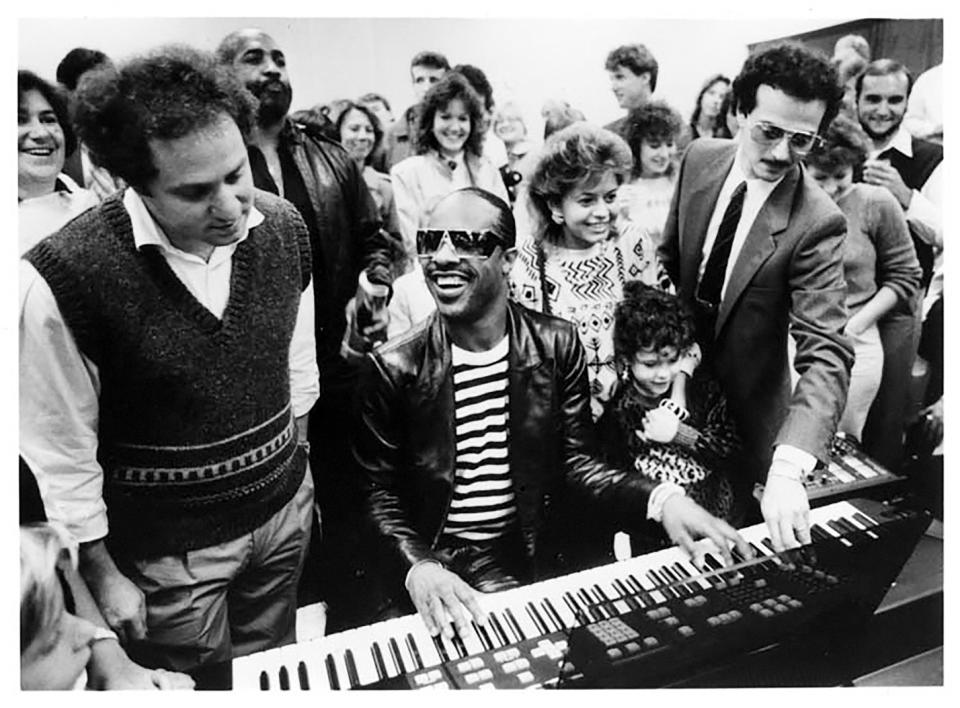 Kurzweil (above left) with Stevie Wonder in 1985, at a postconcert party held by Kurzweil Music Systems.